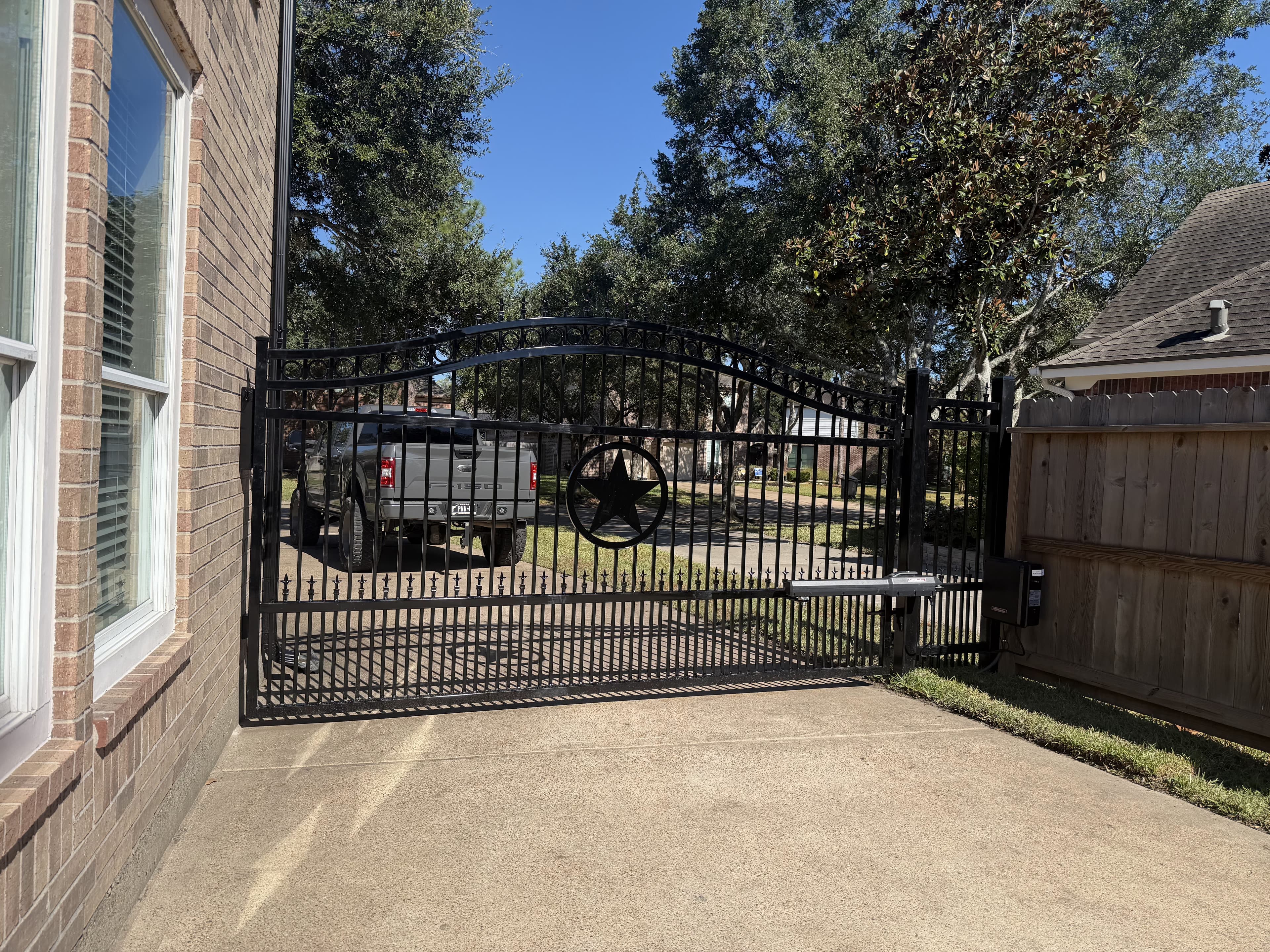 Custom iron driveway gate